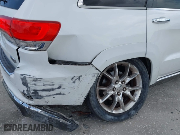 2014 Jeep Grand Cherokee Summit z VIN 1C4RJEJG1EC357948, wystawiony jako IAAI lot #42498652 z przebiegiem 213 715 mil mil oraz . Historia ofert i sprzedaży dostępna na DreamBid. Obrazek 6.