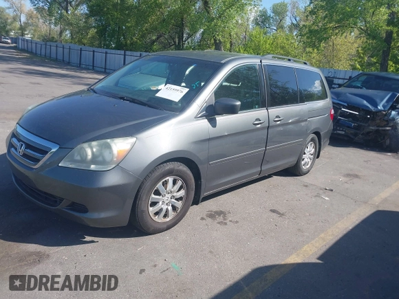 2007 Honda Odyssey EX-L with VIN 5FNRL38777B140916, listed as a IAAI auction lot 42159976 with 167,541 mi miles. Bid and sale history available at carsss.com. Image 2.