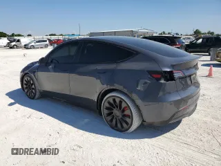 2022 Tesla Model Y Performance z VIN 7SAYGDEF5NF574382, wystawiony jako Copart lot #48531565 z przebiegiem 35 165 mil mil oraz Szkoda całkowita • Salvage title. Historia ofert i sprzedaży dostępna na DreamBid. Obrazek 2.