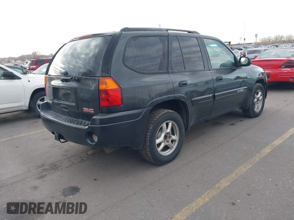 2005 GMC Envoy SLT with VIN 1GKDT13S352258833, listed as a IAAI auction lot 41525149 with 213,829 mi miles. Bid and sale history available at carsss.com. Image 4.