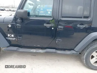 2007 Jeep Wrangler Unlimited X with VIN 1J4GA39177L153387, listed as a IAAI auction lot 42021211 with 207,965 mi miles and . Bid and sale history available at DreamBid. Image 14.