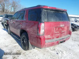 2015 GMC Yukon SLE with VIN 1GKS2AKC2FR514005, listed as a IAAI auction lot 41292783 with 129,413 mi miles. Bid and sale history available at carsss.com. Image 3.