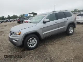 2020 Jeep Grand Cherokee Laredo E with VIN 1C4RJEAG0LC373572, listed as a Copart auction lot 52040195 with 86,604 mi miles and Salvage title. Bid and sale history available at DreamBid. Image 1.