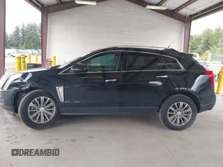 2014 Cadillac SRX Luxury Collection z VIN 3GYFNEE36ES677883, wystawiony jako IAAI lot #42260861 z przebiegiem 51 730 mil mil oraz . Historia ofert i sprzedaży dostępna na DreamBid. Obrazek 14.