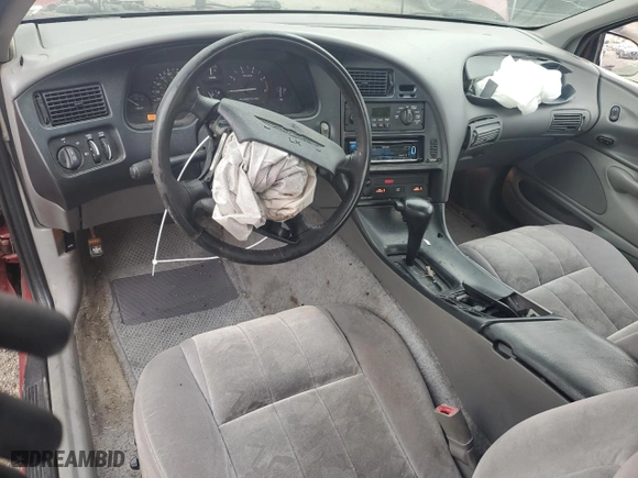 1996 Ford Thunderbird LX with VIN 1FALP62W7TH135632, listed as a Copart auction lot 77134024 with 128,931 mi miles and Salvage Title. Bid and sale history available at carsss.com. Image 8.