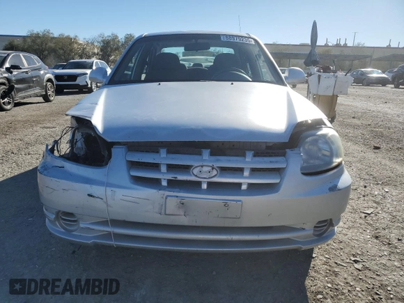 2003 Hyundai Accent GL z VIN KMHCG45C63U413388, wystawiony jako Copart lot #88979235 z przebiegiem 240 928 mil mil oraz Szkoda całkowita • Salvage title. Historia ofert i sprzedaży dostępna na DreamBid. Obrazek 5.