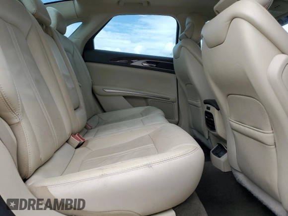 2015 Lincoln MKZ z VIN 3LN6L2J90FR601908, wystawiony jako Copart lot #55516355 z przebiegiem 127 487 mil mil oraz Szkoda całkowita • Salvage title. Historia ofert i sprzedaży dostępna na DreamBid. Obrazek 10.