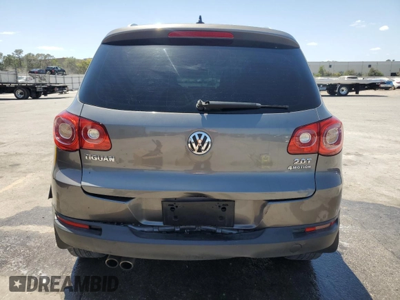 2011 Volkswagen Tiguan SE with VIN WVGBV7AX2BW561987, listed as a Copart auction lot 55385195 with 146,907 mi miles and Salvage Title. Bid and sale history available at DreamBid. Image 6.