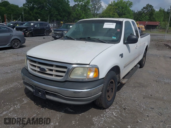 2003 Ford F-150 XL with VIN 1FTRX17L93NB61902, listed as a IAAI auction lot 42096982 with 318,850 mi miles. Bid and sale history available at carsss.com. Image 2.