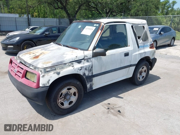 1996 Chevrolet Tracker z VIN 2CNBE1862T6948982, wystawiony jako IAAI lot #42719225 z przebiegiem 257 760 mil mil oraz . Historia ofert i sprzedaży dostępna na DreamBid. Obrazek 2.