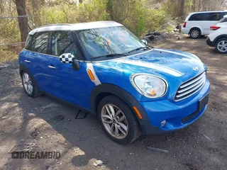2014 MINI Countryman with VIN WMWZB3C59EWR37439, listed as a IAAI auction lot 42110149 with 181,661 mi miles and . Bid and sale history available at DreamBid. Image 1.