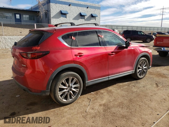 2020 Mazda CX-5 Grand Touring with VIN JM3KFBDM9L1820907, listed as a Copart auction lot 86166054 with 34,007 mi miles and Salvage Title. Bid and sale history available at carsss.com. Image 3.