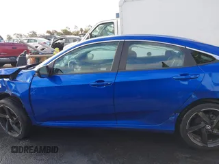 2019 Honda Civic Sport z VIN 19XFC2F8XKE014945, wystawiony jako IAAI lot #41662552 z przebiegiem 47 914 mil mil oraz . Historia ofert i sprzedaży dostępna na DreamBid. Obrazek 13.