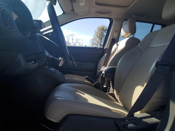2017 Jeep Compass 75th Anniversary Edition with VIN 1C4NJDBBXHD168127, listed as a Copart auction lot 77858624 with 82,702 mi miles and Salvage Title. Bid and sale history available at carsss.com. Image 7.