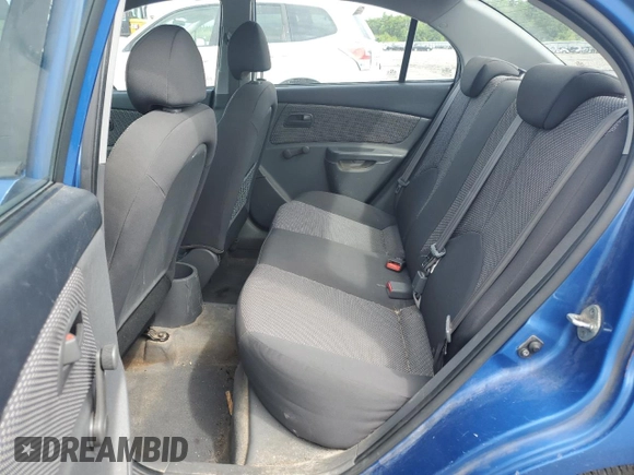 2009 Kia Rio LX with VIN KNADE223696530633, listed as a Copart auction lot 68371794 with 165,505 mi miles and Salvage Title. Bid and sale history available at DreamBid. Image 11.