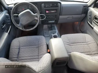 1998 Jeep Cherokee Sport with VIN 1J4FT68S2WL236774, listed as a Copart auction lot 77388734 with 128,591 mi miles and Clean Title. Bid and sale history available at carsss.com. Image 8.