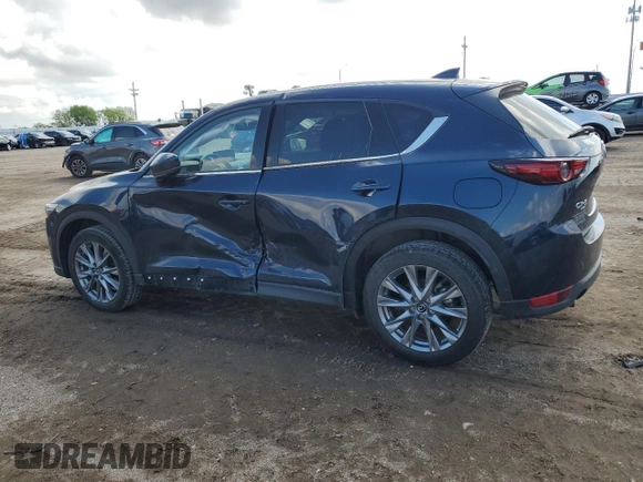 2021 Mazda CX-5 Grand Touring with VIN JM3KFBDM0M0500561, listed as a Copart auction lot 58214665 with 49,543 mi miles and Salvage title. Bid and sale history available at DreamBid. Image 2.