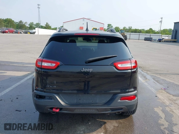 2015 Jeep Cherokee Trailhawk with VIN 1C4PJMBS6FW786622, listed as a IAAI auction lot 42403215 with 148,205 mi miles and . Bid and sale history available at DreamBid. Image 16.