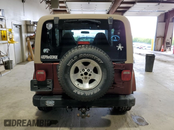 2002 Jeep Wrangler Sahara с VIN 1J4FA59S62P751858, выставлен на аукционе Copart как лот 56638165 с пробегом 270 770 миль миль и Списание • Salvage title. История ставок и продаж доступна на DreamBid. Изображение 6.