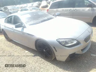 2015 BMW 6 Series 640i z VIN WBA6A0C57FGB53750, wystawiony jako IAAI lot #30357803 z przebiegiem 59 462 mil mil oraz . Historia ofert i sprzedaży dostępna na DreamBid. Obrazek 1.