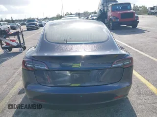 2020 Tesla Model 3 Standard Range Plus with VIN 5YJ3E1EA0LF744046, listed as a IAAI auction lot 41939894 with 102,576 mi miles. Bid and sale history available at carsss.com. Image 16.