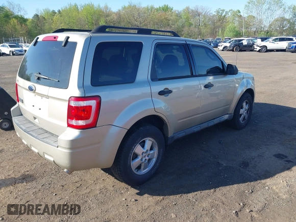 2010 Ford Escape XLT with VIN 1FMCU9D75AKB64794, listed as a IAAI auction lot 42141609 with 118,791 mi miles. Bid and sale history available at carsss.com. Image 4.