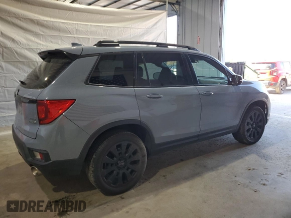 2023 Honda Passport Elite with VIN 5FNYF8H03PB034613, listed as a Copart auction lot 54009215 with 102,841 mi miles and Salvage title. Bid and sale history available at DreamBid. Image 3.