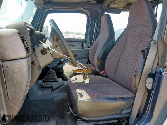 2000 Jeep Wrangler Sport with VIN 1J4FA49S9YP742414, listed as a Copart auction lot 61471065 with 139,572 mi miles and Clean title. Bid and sale history available at DreamBid. Image 7.