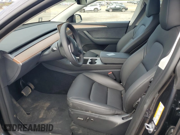 2025 Tesla Model Y Long Range with VIN 7SAYGDED7SF320702, listed as a Copart auction lot 54655325 with 1,169 mi miles and Salvage Title. Bid and sale history available at DreamBid. Image 7.