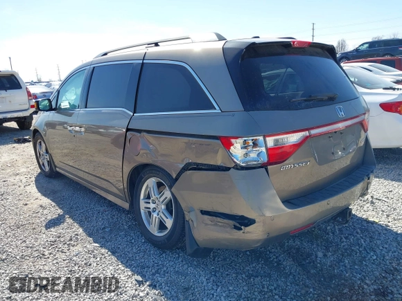 2012 Honda Odyssey Touring with VIN 5FNRL5H9XCB110672, listed as a IAAI auction lot 41826895 with 159,927 mi miles. Bid and sale history available at carsss.com. Image 3.