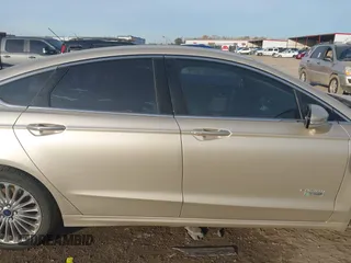 2017 Ford Fusion Titanium z VIN 3FA6P0SU5HR373140, wystawiony jako IAAI lot #41082406 z przebiegiem 98 422 mil mil oraz . Historia ofert i sprzedaży dostępna na DreamBid. Obrazek 13.