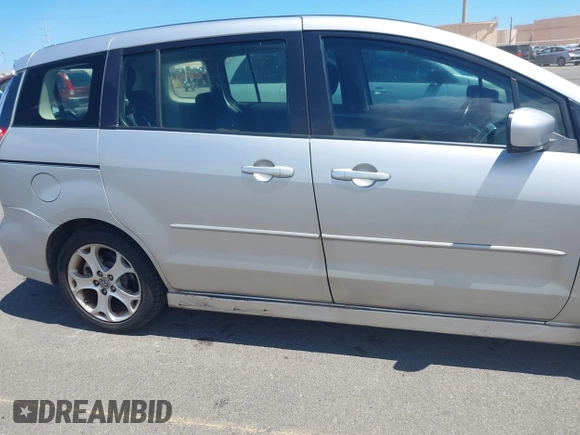 2009 Mazda 5 Sport with VIN JM1CR293990334438, listed as a IAAI auction lot 42561953 with 118,178 mi miles and . Bid and sale history available at DreamBid. Image 6.