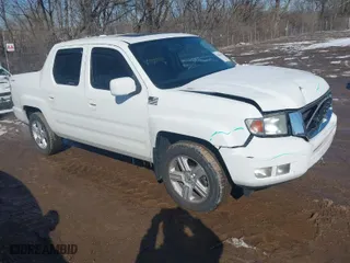 2013 Honda Ridgeline RTL with VIN 5FPYK1F54DB015461, listed as a IAAI auction lot 41601818 with 107,211 mi miles. Bid and sale history available at carsss.com. Image 1.