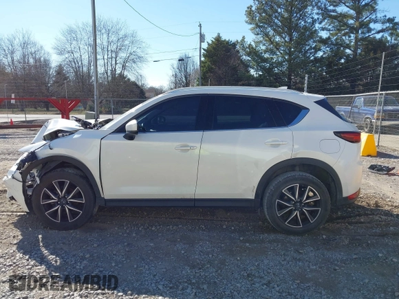 2018 Mazda CX-5 Grand Touring with VIN JM3KFADM0J0377026, listed as a IAAI auction lot 41649686 with 100,901 mi miles and . Bid and sale history available at DreamBid. Image 14.