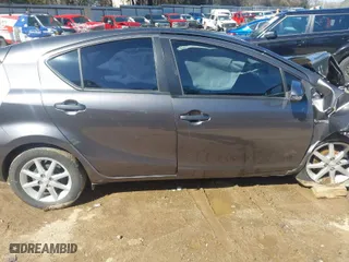 2014 Toyota Prius c One with VIN JTDKDTB32E1561856, listed as a IAAI auction lot 41591107 with 104,363 mi miles. Bid and sale history available at carsss.com. Image 14.