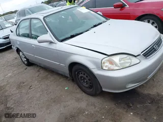 1999 Honda Civic EX with VIN 1HGEJ8648XL030353, listed as a IAAI auction lot 41827260 with 68,660 mi miles. Bid and sale history available at carsss.com. Image 1.