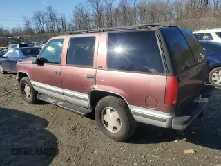 1997 GMC Yukon with VIN 1GKEK13R1VJ702558, listed as a Copart auction lot 85930054 with 165,837 mi miles and Salvage Title. Bid and sale history available at carsss.com. Image 2.
