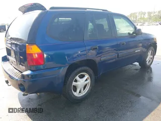 2004 GMC Envoy SLE with VIN 1GKDT13S242391968, listed as a IAAI auction lot 42079420 with 234,611 mi miles. Bid and sale history available at carsss.com. Image 4.
