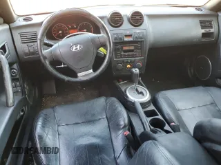 2003 Hyundai Tiburon GT z VIN KMHHN65F63U060104, wystawiony jako Copart lot #84560184 z przebiegiem 160 120 mil mil oraz Czysty tytuł • Clean title. Historia ofert i sprzedaży dostępna na DreamBid. Obrazek 8.