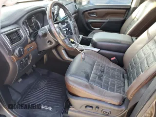 2016 Nissan Titan XD Platinum Reserve with VIN 1N6BA1F25GN506566, listed as a Copart auction lot 74627704 with 87,012 mi miles and Salvage Title. Bid and sale history available at carsss.com. Image 7.