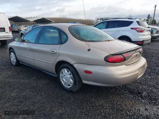 1999 Ford Taurus SE with VIN 1FAFP53U0XG209151, listed as a IAAI auction lot 41778371 with 107,262 mi miles. Bid and sale history available at carsss.com. Image 3.