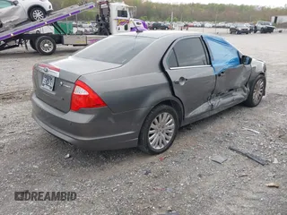 2010 Ford Fusion Hybrid z VIN 3FADP0L31AR326917, wystawiony jako IAAI lot #41938486 z przebiegiem 132 845 mil mil oraz . Historia ofert i sprzedaży dostępna na DreamBid. Obrazek 4.