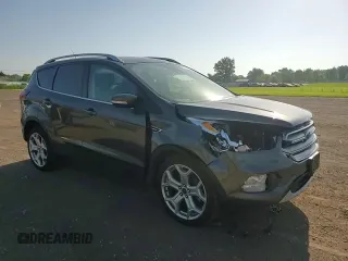 2019 Ford Escape Titanium with VIN 1FMCU0J96KUB22884, listed as a Copart auction lot 61979665 with 63,824 mi miles and Salvage title. Bid and sale history available at DreamBid. Image 14.