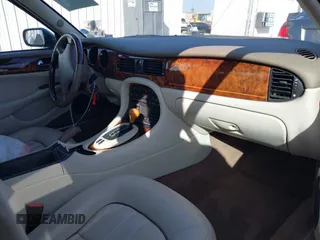 2003 Jaguar XJ 8 with VIN SAJDA14C03LF58706, listed as a IAAI auction lot 41619740 with 95,293 mi miles and . Bid and sale history available at DreamBid. Image 5.
