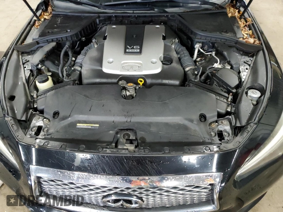 2015 Infiniti Q50 Premium z VIN JN1BV7AR2FM419987, wystawiony jako Copart lot #57813825 z przebiegiem 99 229 mil mil oraz Nie do naprawy. Historia ofert i sprzedaży dostępna na DreamBid. Obrazek 11.