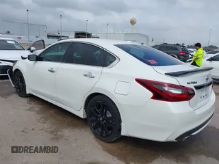 2018 Nissan Altima SR with VIN 1N4AL3AP3JC290863, listed as a IAAI auction lot 41933628 with 121,771 mi miles and . Bid and sale history available at carsss.com. Image 3.