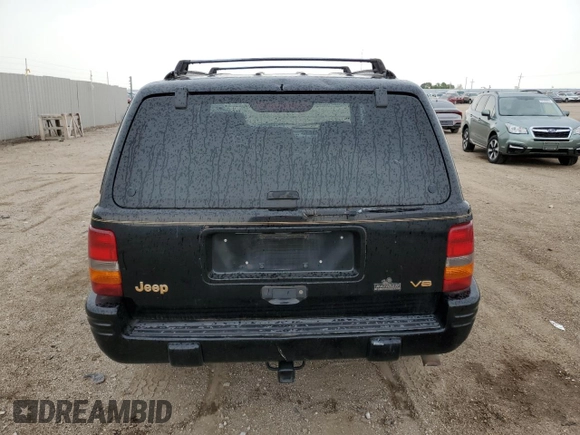 1997 Jeep Grand Cherokee Limited z VIN 1J4GZ78Y8VC586034, wystawiony jako Copart lot #58061705 z przebiegiem 244 355 mil mil oraz Czysty tytuł • Clean title. Historia ofert i sprzedaży dostępna na DreamBid. Obrazek 6.