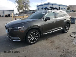 2018 Mazda CX-9 Grand Touring z VIN JM3TCBDY1J0202595, wystawiony jako Copart lot #50998865 z przebiegiem Nie podano mil oraz Szkoda całkowita • Salvage title. Historia ofert i sprzedaży dostępna na DreamBid. Obrazek 1.