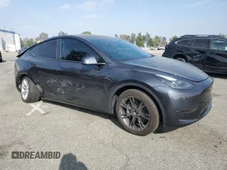 2024 Tesla Model Y Long Range with VIN 7SAYGDEE2RA244242, listed as a Copart auction lot 52635095 with 4,994 mi miles and Salvage title. Bid and sale history available at DreamBid. Image 4.