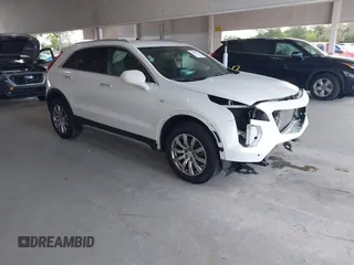 2019 Cadillac XT4 FWD Premium Luxury z VIN 1GYFZCR49KF142039, wystawiony jako IAAI lot #42259448 z przebiegiem 47 620 mil mil oraz . Historia ofert i sprzedaży dostępna na DreamBid. Obrazek 1.